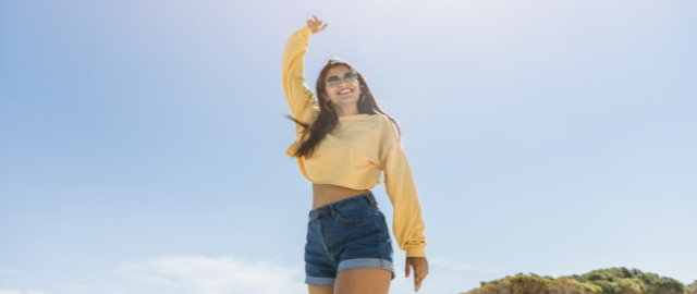 Rear view of mother and daugher hiking in a forest