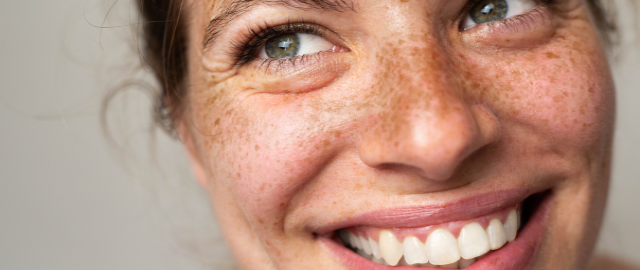 Close up of a beautiful women with healthy teeth free from dental disease.