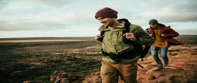 Male menopause andropause blog image two smiling males walking hiking on mountain