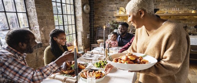 Family gathered to eat Christmas dinner.