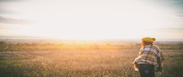happy girl topping up her vitamin d, enjoying life and freedom in autumn in nature