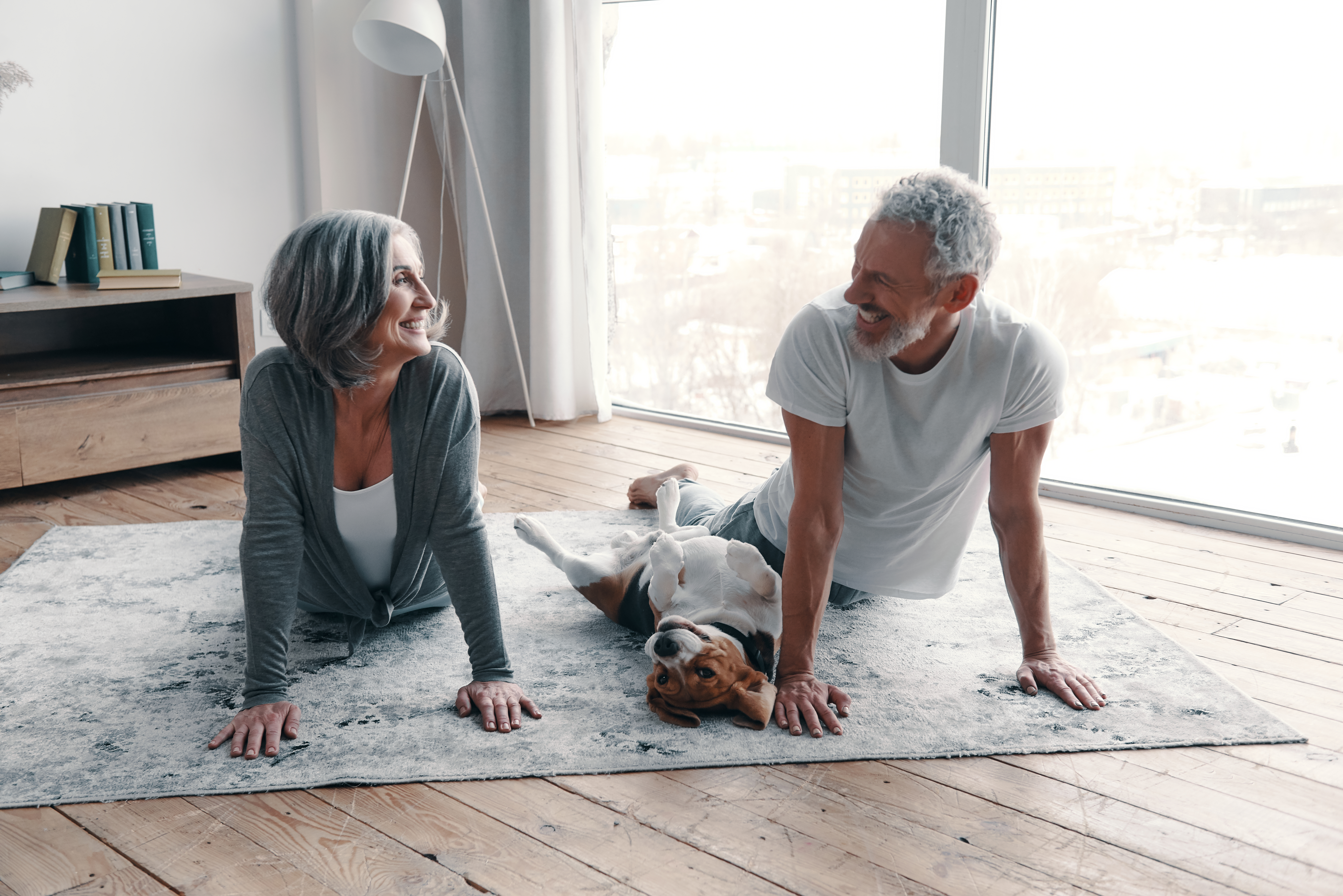 Looking after their joint health through exercise and nutrition: loving senior couple in sports clothing