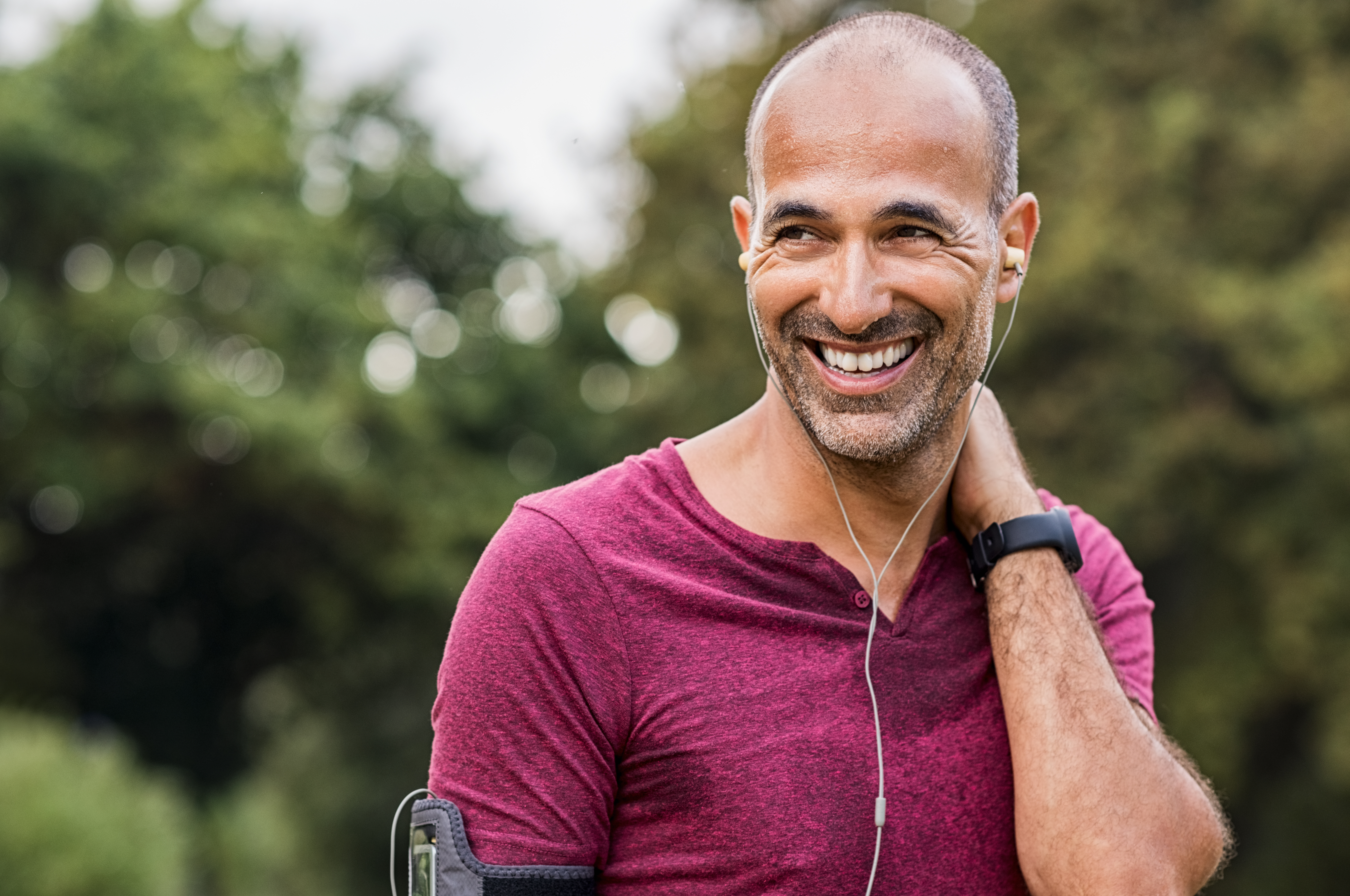 Mature man resting after jogging. In a systemic review exercising was shown to favourably influence prostate health, particularly symptoms of benign prostatic hyperplasia.